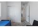 Bedroom featuring a bed, sliding closet doors, and an open doorway at 713 Webber Park St, Henderson, NV 89011