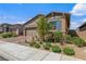 Charming single-story home with a well-manicured front yard and a two car garage at 713 Webber Park St, Henderson, NV 89011