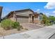 Charming single-story home with a well-manicured front yard and a two car garage at 713 Webber Park St, Henderson, NV 89011
