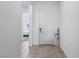 Welcoming foyer with white door and trim, tile flooring, and views to the bedroom at 713 Webber Park St, Henderson, NV 89011