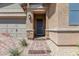 Inviting front entrance with a brick walkway and decorative stone accents at 713 Webber Park St, Henderson, NV 89011