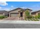 Charming single-story home with a well-manicured lawn and inviting curb appeal at 713 Webber Park St, Henderson, NV 89011