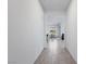 Bright hallway showcasing tile flooring leading into the adjacent dining and living areas at 713 Webber Park St, Henderson, NV 89011