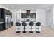 Stylish kitchen with stainless steel appliances, modern island and dark cabinets at 713 Webber Park St, Henderson, NV 89011