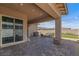 Inviting covered patio featuring a brick floor, gas fire pit and outdoor seating for relaxation at 713 Webber Park St, Henderson, NV 89011
