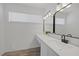 Modern bathroom with a large vanity, quartz countertops, and updated fixtures at 720 Sam Jonas Dr, Las Vegas, NV 89145