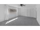 Spacious bedroom with carpet, ceiling fan, and a large window at 720 Sam Jonas Dr, Las Vegas, NV 89145