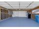 Spacious garage with blue floor, ample storage, and utility connections for convenience at 720 Sam Jonas Dr, Las Vegas, NV 89145