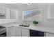 Bright kitchen with white cabinetry and countertops, plus stainless steel appliances at 720 Sam Jonas Dr, Las Vegas, NV 89145