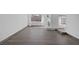 Open living room with new floors, a large window, and a stone fireplace at 720 Sam Jonas Dr, Las Vegas, NV 89145