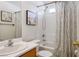 Full bathroom with tub-shower combination and a single sink vanity with framed art above at 7572 Hope Valley St, Las Vegas, NV 89139