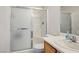 A streamlined full bath features a frosted shower and a single-sink vanity at 7572 Hope Valley St, Las Vegas, NV 89139