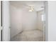 A sun-filled bedroom with neutral carpet, a ceiling fan, and bright white walls at 7572 Hope Valley St, Las Vegas, NV 89139