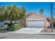 Charming single-story home with a well-maintained lawn, mature trees, and a two-car garage at 7572 Hope Valley St, Las Vegas, NV 89139