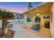 Inviting covered patio with pool, spa, and outdoor seating area at 781 Wigan Pier Dr, Henderson, NV 89002