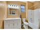 Well-lit bathroom with a large mirror, vanity, and a shower-tub combination at 781 Wigan Pier Dr, Henderson, NV 89002