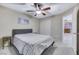Comfortable bedroom with ceiling fan; view into the living room beyond at 781 Wigan Pier Dr, Henderson, NV 89002