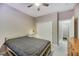 Comfortable bedroom with a ceiling fan, a sliding closet door, and a functional layout at 781 Wigan Pier Dr, Henderson, NV 89002