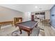 Spacious game room featuring a billiard table, wood-look floors, and view of the home's entry at 781 Wigan Pier Dr, Henderson, NV 89002