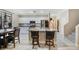 Well-equipped kitchen with granite counters, stainless appliances, and breakfast bar seating at 781 Wigan Pier Dr, Henderson, NV 89002