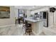 Bright kitchen featuring granite counters, stainless steel appliances, and casual dining area at 781 Wigan Pier Dr, Henderson, NV 89002