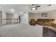 Expansive living room area with plush seating and a view of the staircase at 781 Wigan Pier Dr, Henderson, NV 89002