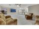 Open living space with comfortable seating, a TV, and a view of the upstairs landing at 781 Wigan Pier Dr, Henderson, NV 89002