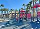 Playground area with colorful structures, providing a fun and safe recreational space for children in the community at 781 Wigan Pier Dr, Henderson, NV 89002