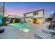 Inviting backyard features a sparkling pool, spa, and covered patio, perfect for outdoor relaxation and entertaining at 781 Wigan Pier Dr, Henderson, NV 89002