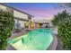 Stunning pool area surrounded by lush greenery, offering a serene and private outdoor oasis at 781 Wigan Pier Dr, Henderson, NV 89002