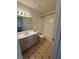 Bathroom with a vanity, mirror, shower/tub, and toilet at 8049 Celestial Ave # 201, Las Vegas, NV 89128
