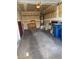 Clean and organized garage with shelving, storage, and water heater at 8049 Celestial Ave # 201, Las Vegas, NV 89128