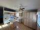 Spacious kitchen featuring an island, large pantry, modern appliances, and natural lighting at 8049 Celestial Ave # 201, Las Vegas, NV 89128