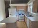 Well-lit kitchen with an island, white appliances, and abundant cabinet space at 8049 Celestial Ave # 201, Las Vegas, NV 89128