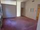 Spacious living room with neutral walls, neutral carpeting and bright natural lighting at 8049 Celestial Ave # 201, Las Vegas, NV 89128