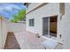 A private backyard featuring low-maintenance gravel landscaping and access from a sliding glass door at 8174 Amphora St, Las Vegas, NV 89139