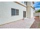 Side yard featuring rock landscaping and a sliding glass door leading into the home at 8174 Amphora St, Las Vegas, NV 89139