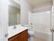 Standard bathroom with tub and shower combination with updated vanity and toilet at 8174 Amphora St, Las Vegas, NV 89139
