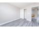 A bedroom with fresh paint, modern floors, and a closet at 8174 Amphora St, Las Vegas, NV 89139