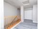 A hallway features a wood railing, fresh paint, and vinyl floors at 8174 Amphora St, Las Vegas, NV 89139