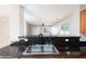 A kitchen featuring granite countertops and a stainless steel sink at 8174 Amphora St, Las Vegas, NV 89139