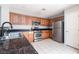A kitchen featuring stainless steel appliances and oak cabinets with granite countertops at 8174 Amphora St, Las Vegas, NV 89139