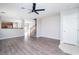 Open-concept living room featuring hardwood floors, neutral paint, and a ceiling fan at 8174 Amphora St, Las Vegas, NV 89139