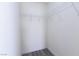 Bright walk-in closet features wire shelving and durable gray wood-look flooring at 8174 Amphora St, Las Vegas, NV 89139