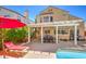 A beautiful backyard with a pool, patio and lounging area, perfect for entertaining at 8308 Tide Pool Dr, Las Vegas, NV 89128