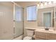 Functional bathroom with a shower-tub, toilet, and a vanity with mirror, designed for practical use at 8308 Tide Pool Dr, Las Vegas, NV 89128