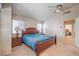 Comfortable bedroom featuring a wooden bed frame and two side tables with lamps, creating a cozy atmosphere at 8308 Tide Pool Dr, Las Vegas, NV 89128