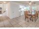 Dining area connected to the kitchen, featuring a wooden table and views of the staircase at 8308 Tide Pool Dr, Las Vegas, NV 89128