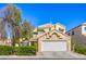 Charming two-story home features a well-manicured lawn, tile roof, and attached two-car garage at 8308 Tide Pool Dr, Las Vegas, NV 89128