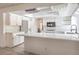 Modern kitchen with white cabinets, quartz countertops, and stainless steel appliances at 8308 Tide Pool Dr, Las Vegas, NV 89128